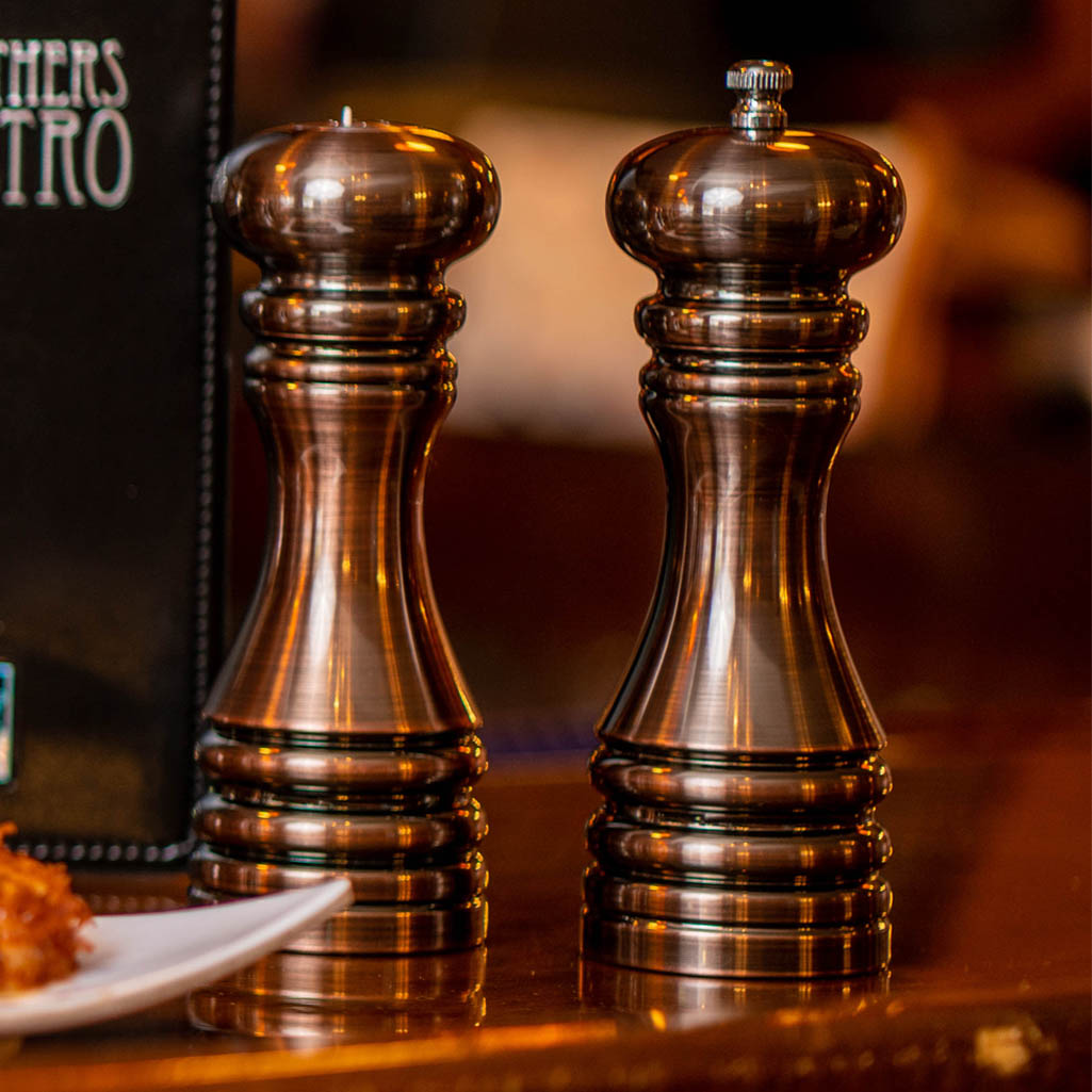 90070 7 Inch Acrylic Burnished Copper Pepper Mill & Shaker Set, Table View